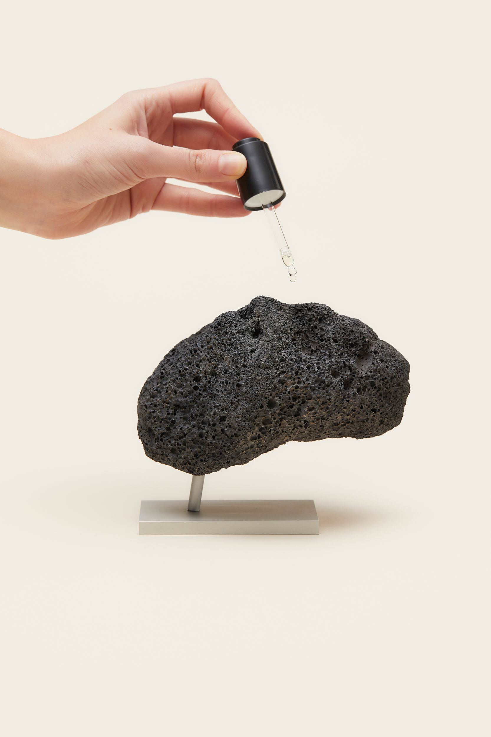 MERCHERY_FEB_Lava rock diffuser_holding.jpg