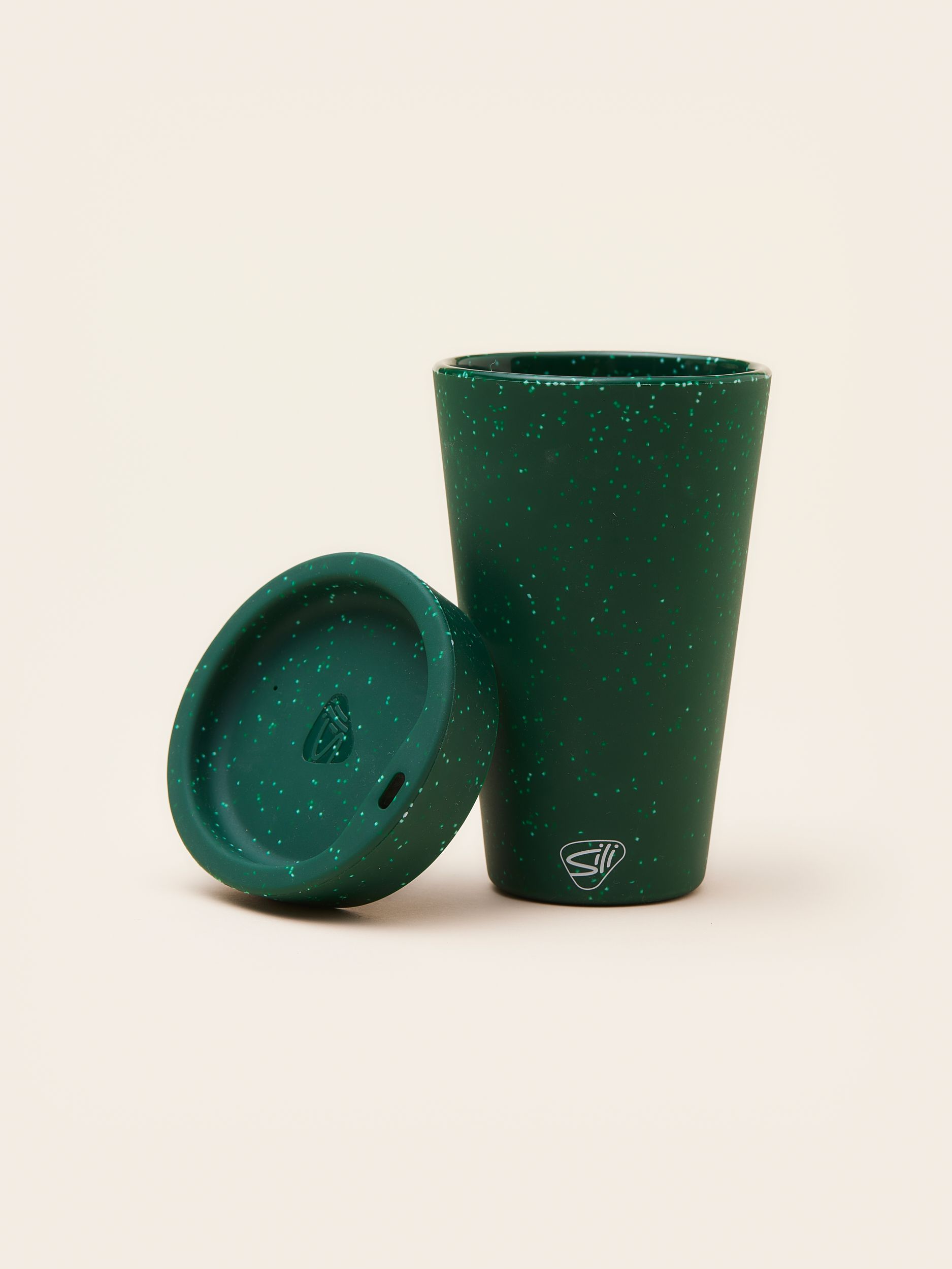 thumbnail_MERCHERY_Silicone tumbler_speckled green_lid on the side.jpg